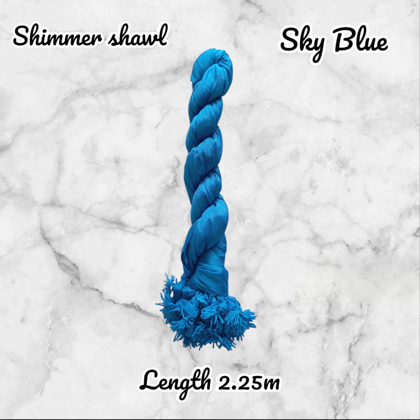 Blue yarn skein on a marble background with text indicating 'Shimmer shawl', 'Sky Blue', and 'Length 2.25m'.