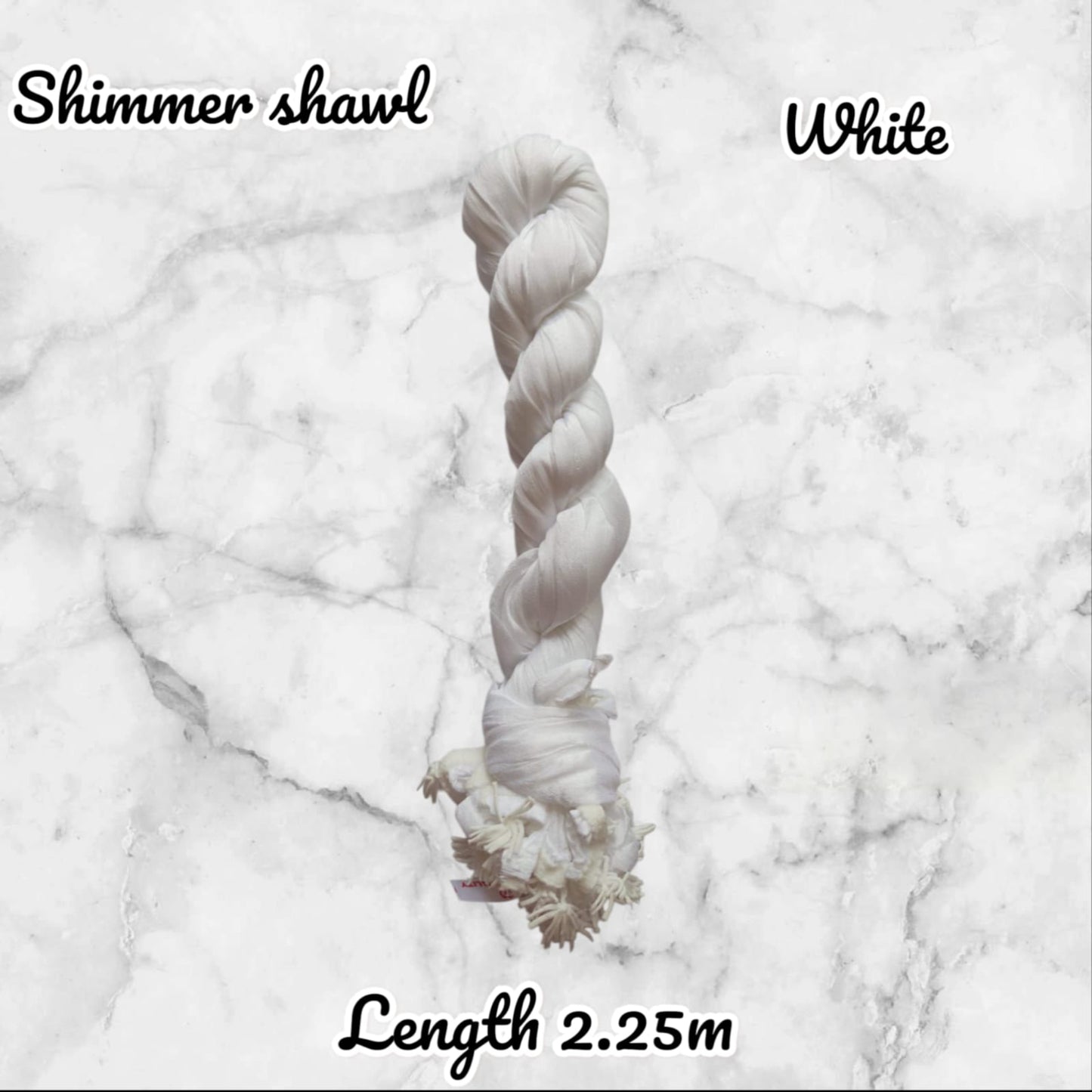 White shimmer shawl on a marble background with text indicating length.