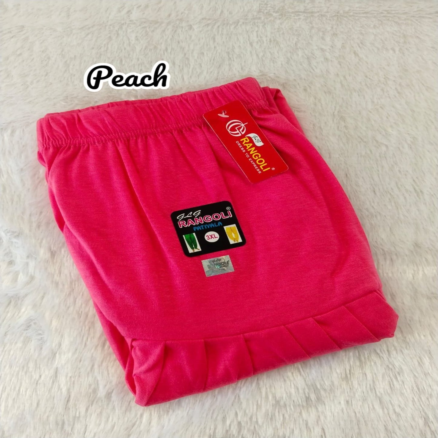 Pink shorts with a tag on a light background