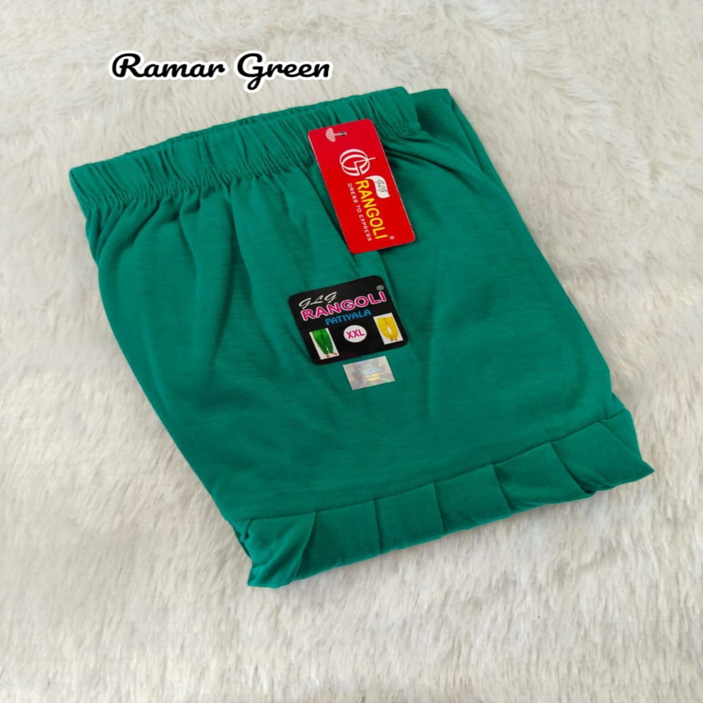 Green shorts with a brand tag on a light background