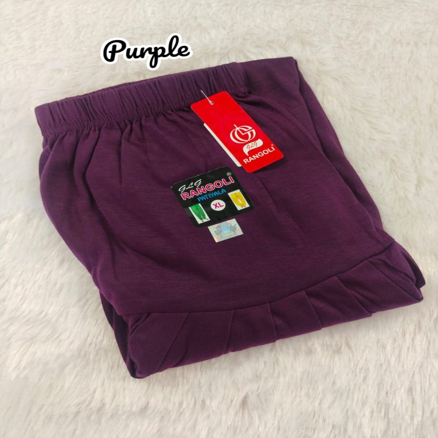 Purple shorts with a brand tag on a light background