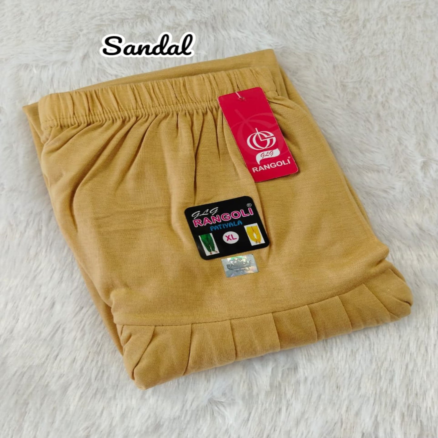 Mustard yellow shorts with Rangoli branding on a light gray background