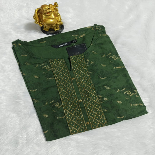 Green embroidered garment with a gold statue on a white background