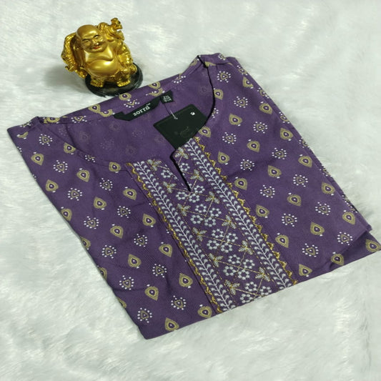 Purple patterned shirt with a gold figurine on a white background