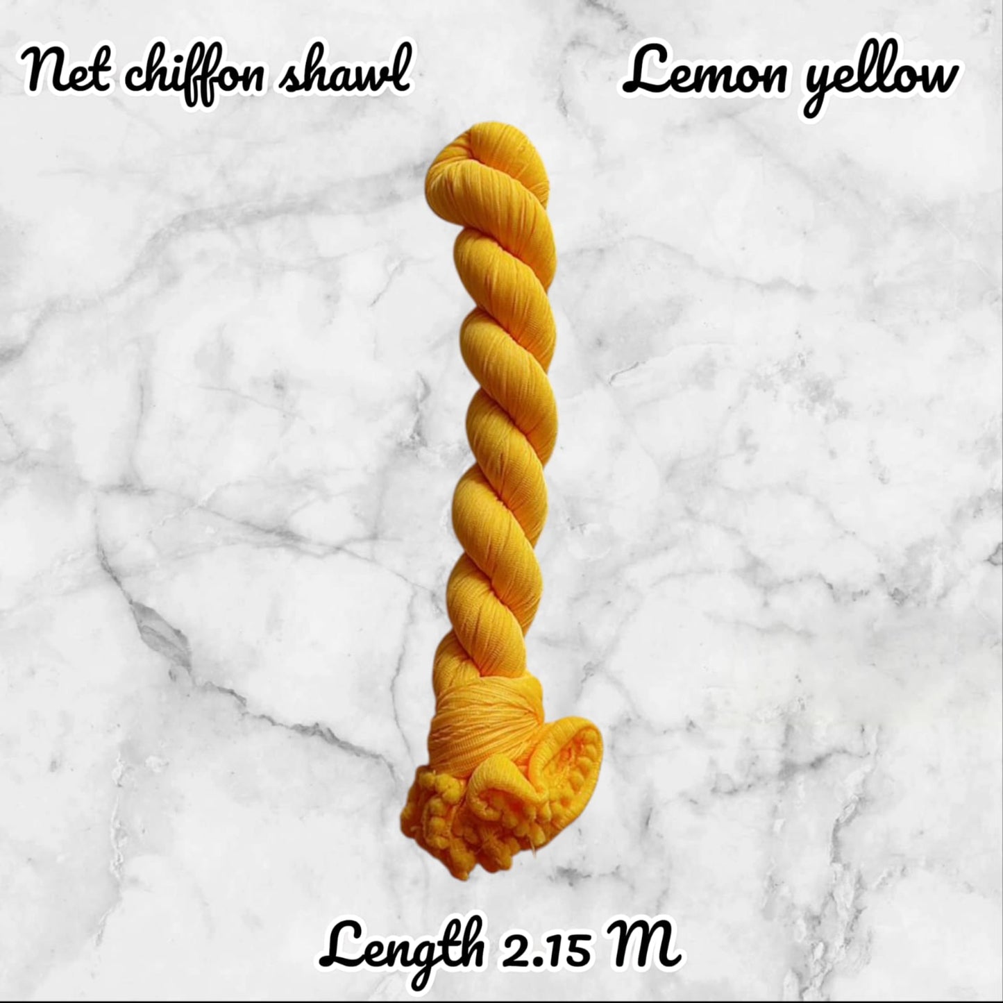 Braided lemon yellow chiffon shawl on a marble background