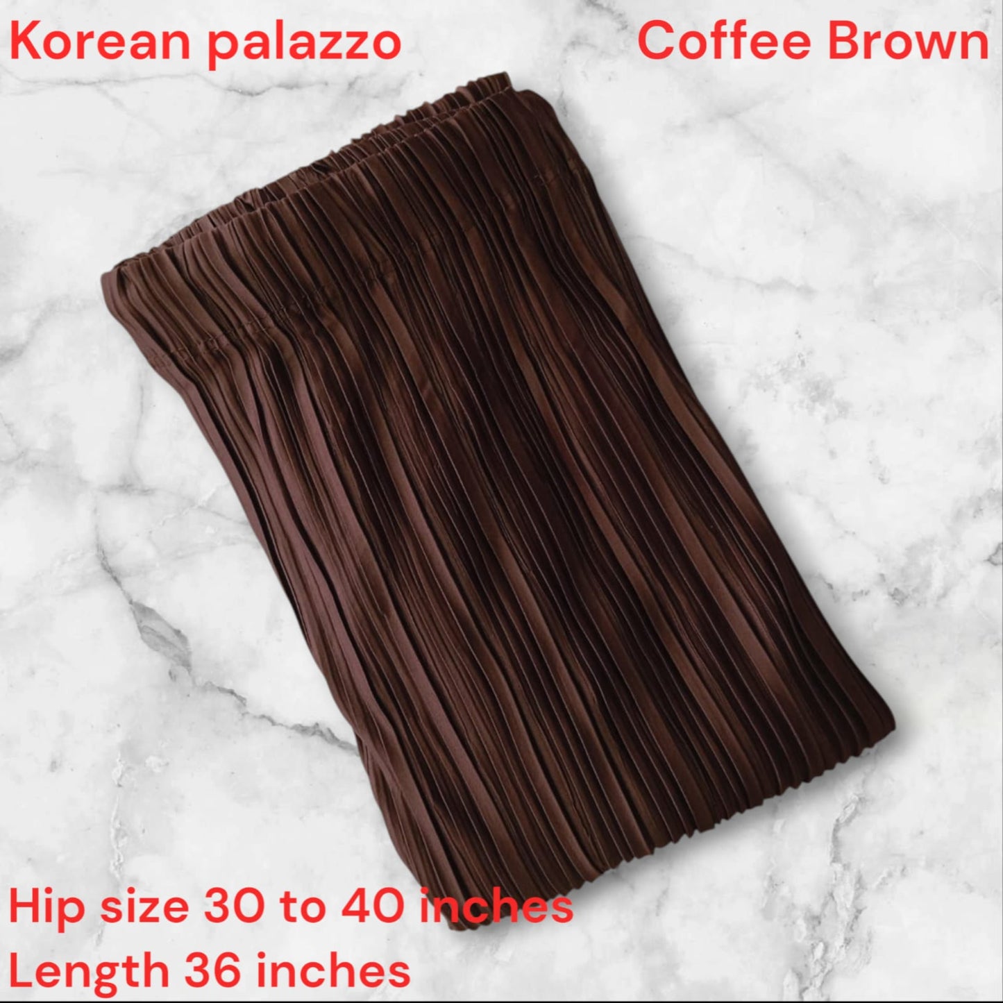 Brown pleated skirt on a marble background with text about size and length.