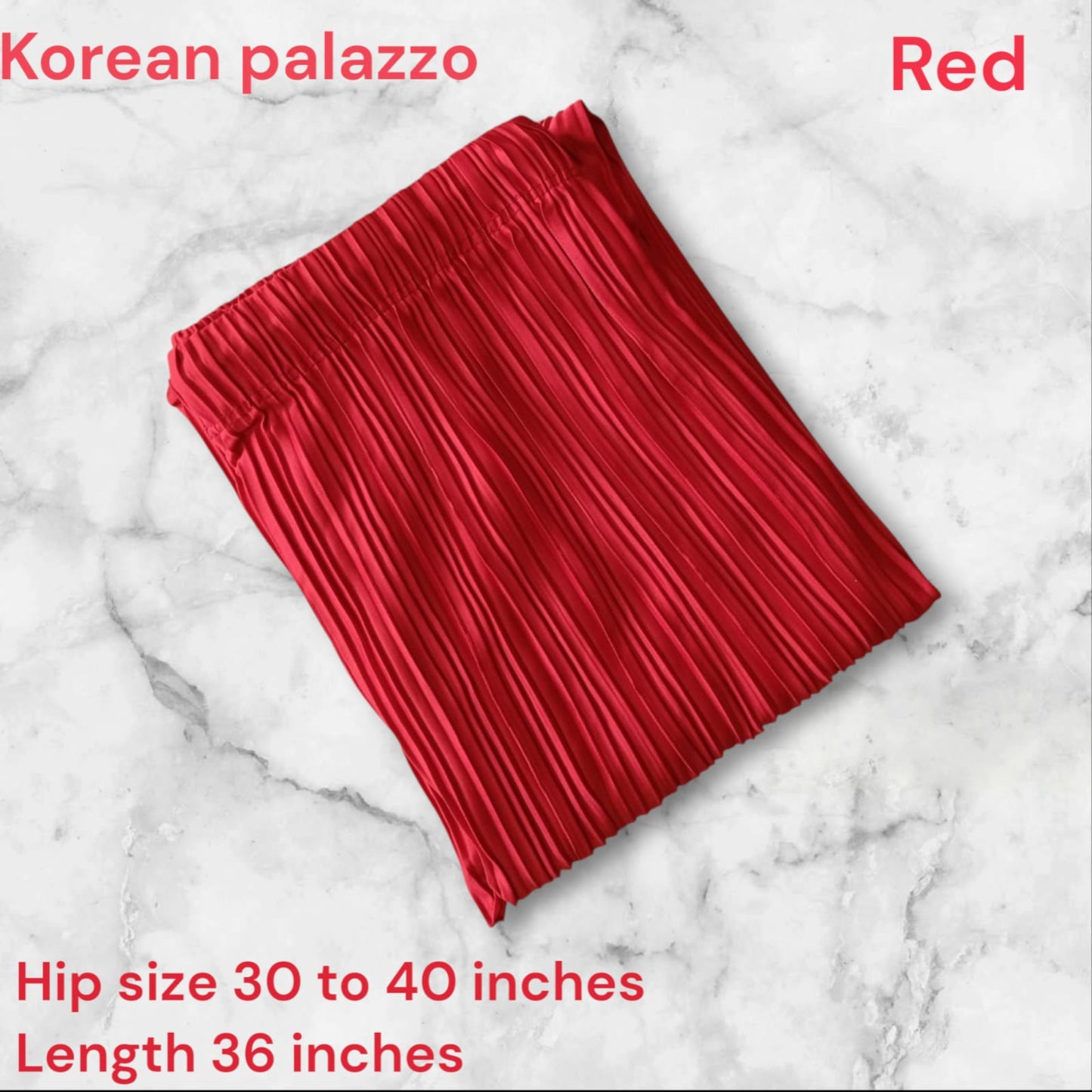 Red pleated skirt on a marble background with product details.