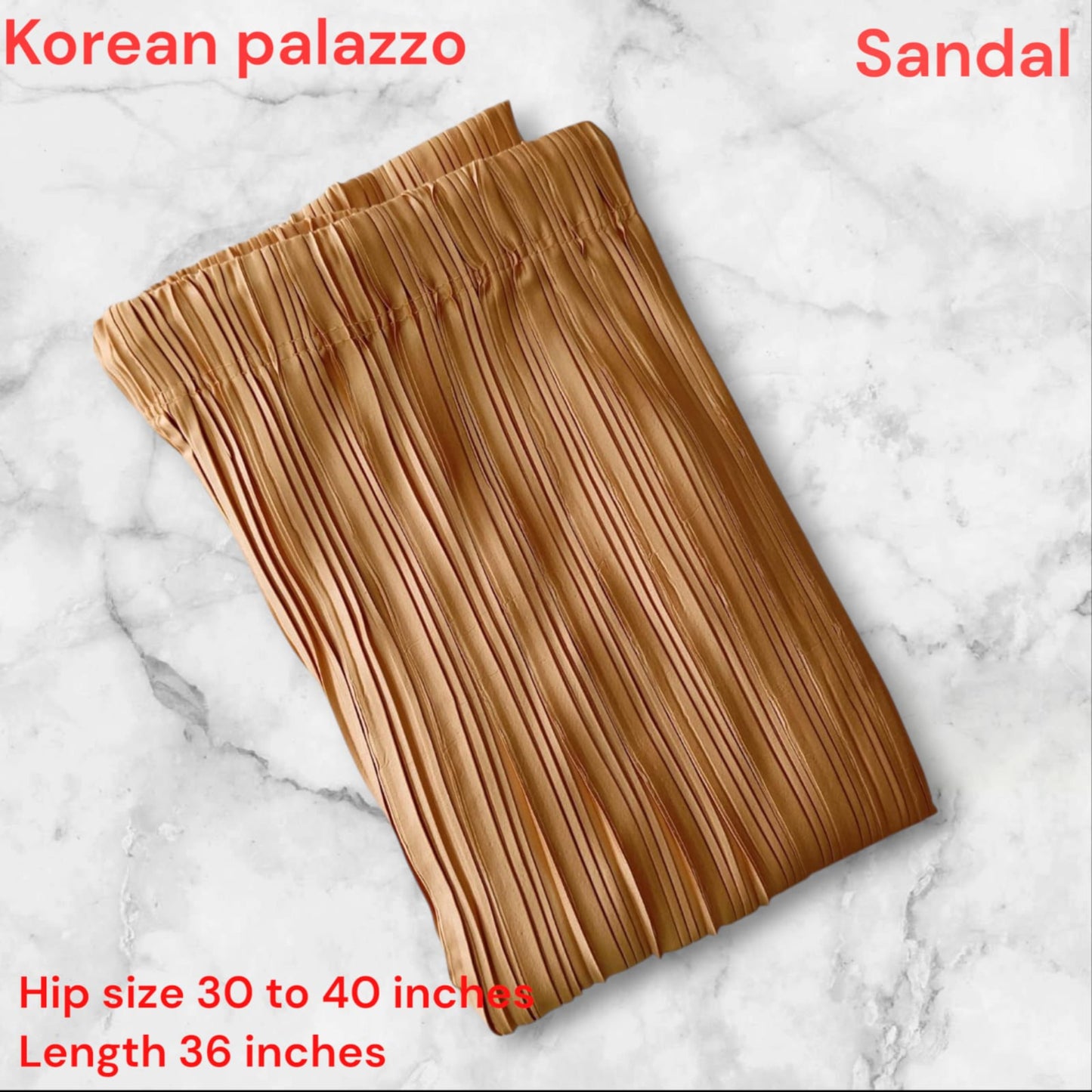 Brown pleated skirt on a marble background with text indicating size and length.