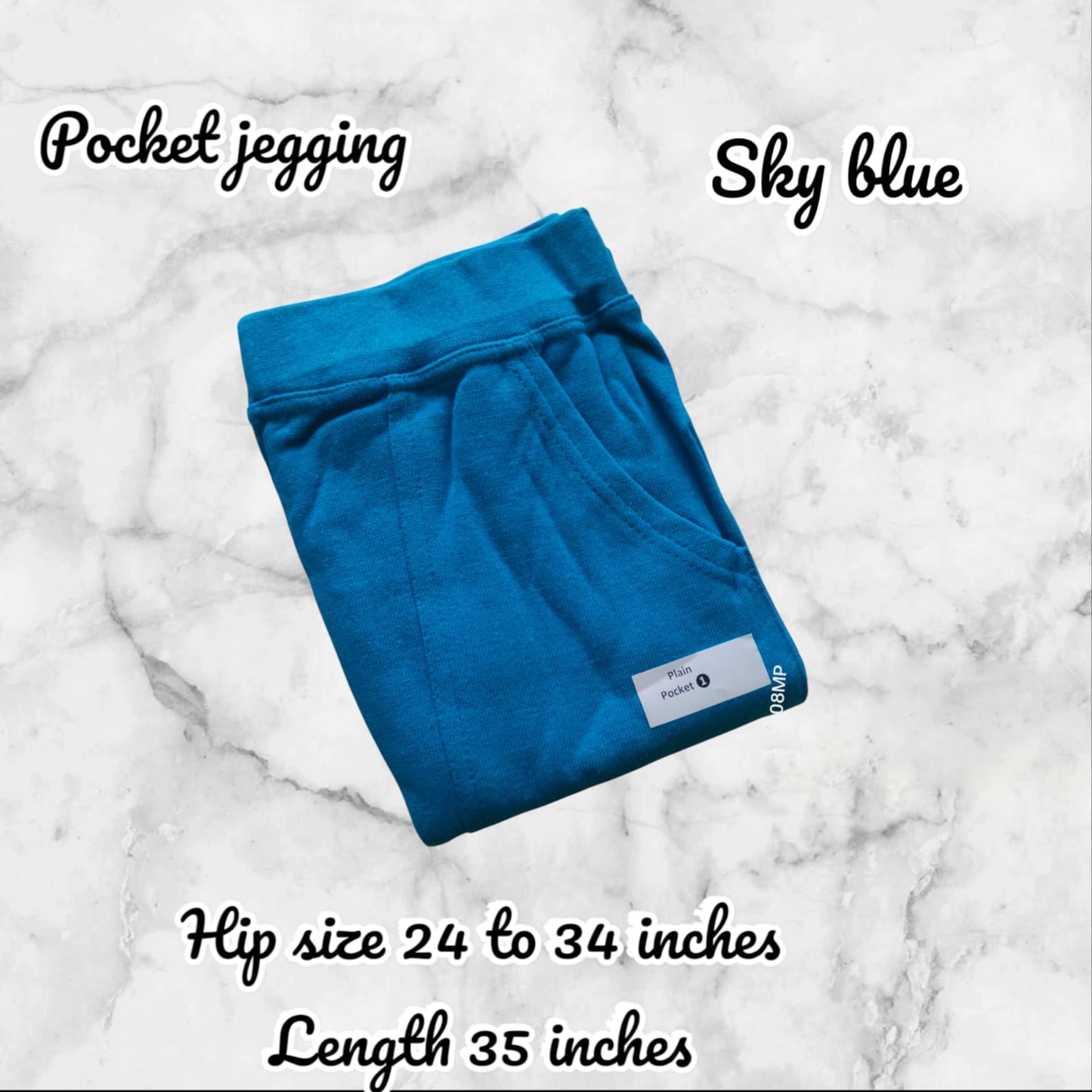 Folded blue pocket jegging on a marble background with product details.