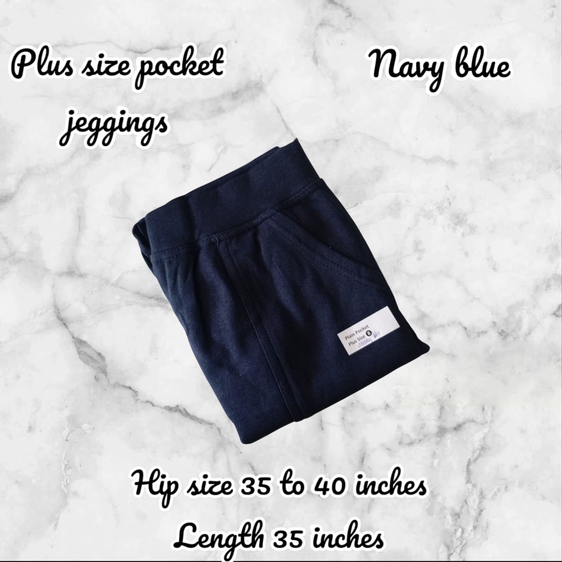 Navy blue plus size pocket jeggings on a marble background with text detailing size and length.