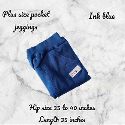 Folded blue plus size pocket jeggings on a marble background with text about size and color.