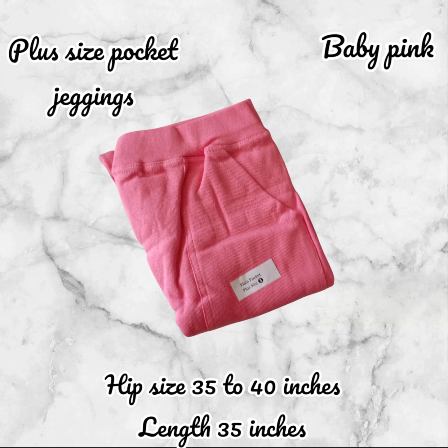 Folded pink jeggings on a marble surface with text describing features.