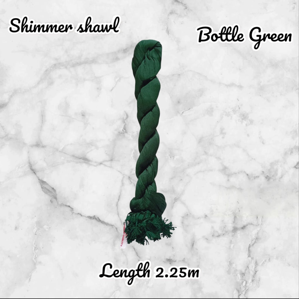 Green braided toy with text indicating color and length on a marble background
