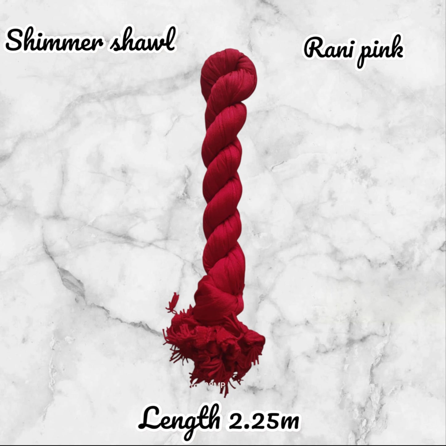 Red yarn skein on a marble background with text indicating 'Shimmer shawl' and 'Rani pink'.