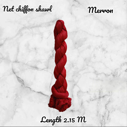 Red chiffon shawl labeled 'Merron' on a marble background